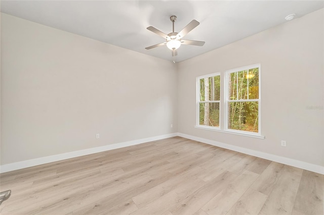 spare room featuring ceiling fan and light hardwood / wood-style floors