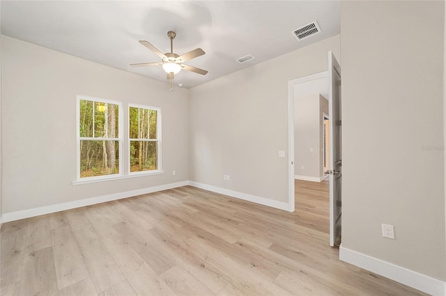 empty room featuring light hardwood / wood-style flooring and ceiling fan