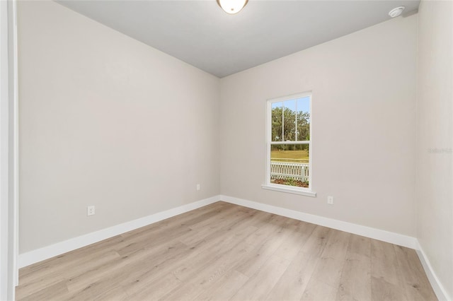 spare room with light hardwood / wood-style flooring