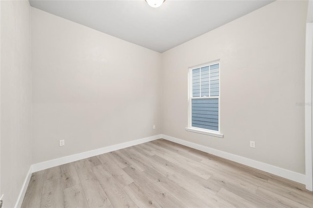 spare room with light hardwood / wood-style floors