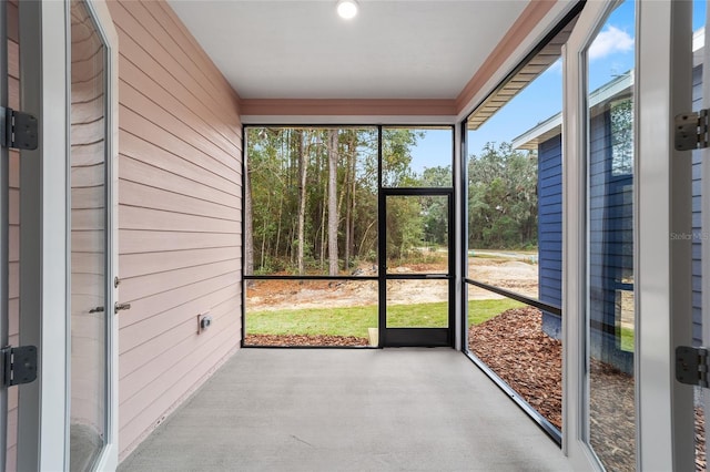 unfurnished sunroom featuring a healthy amount of sunlight