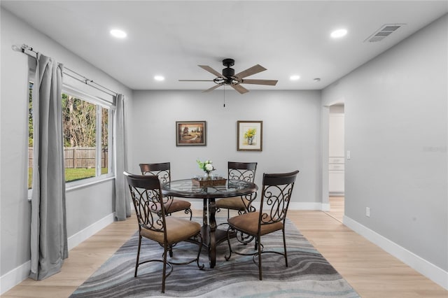 dining space featuring light hardwood / wood-style floors and ceiling fan