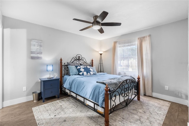 bedroom featuring hardwood / wood-style floors and ceiling fan