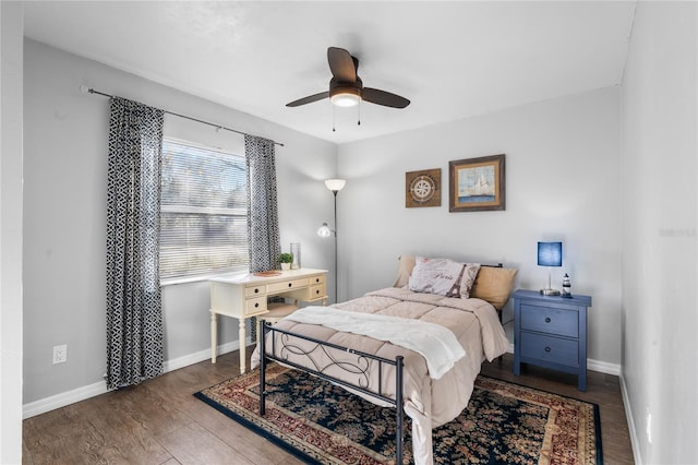 bedroom featuring dark hardwood / wood-style flooring and ceiling fan