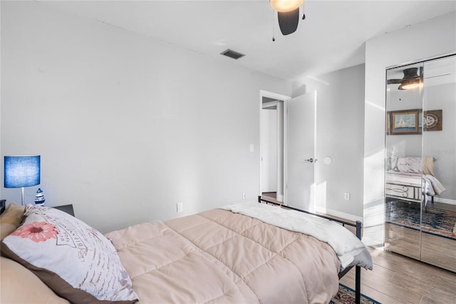 bedroom with hardwood / wood-style flooring and ceiling fan