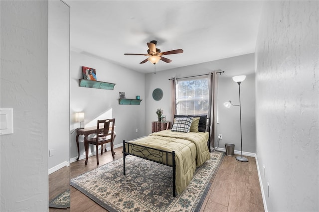 bedroom featuring ceiling fan and wood-type flooring