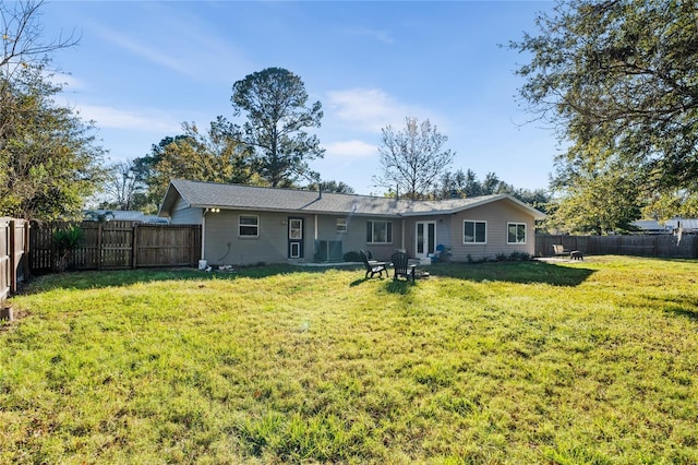 back of property featuring a lawn