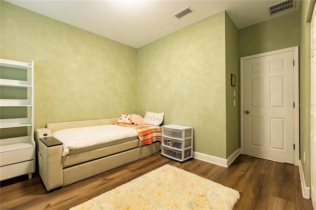 bedroom featuring dark wood-type flooring