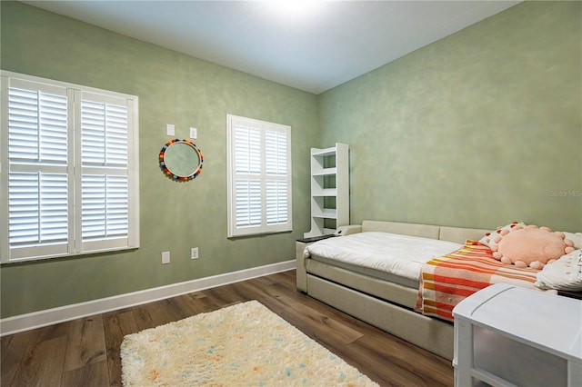 bedroom featuring dark hardwood / wood-style flooring