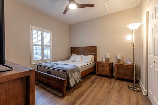 bedroom featuring ceiling fan and light hardwood / wood-style flooring