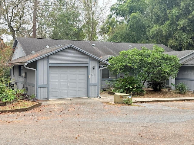 ranch-style home with a garage