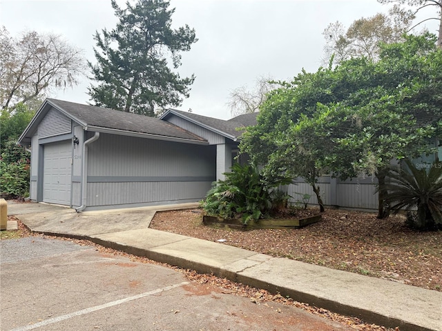 view of side of home with a garage