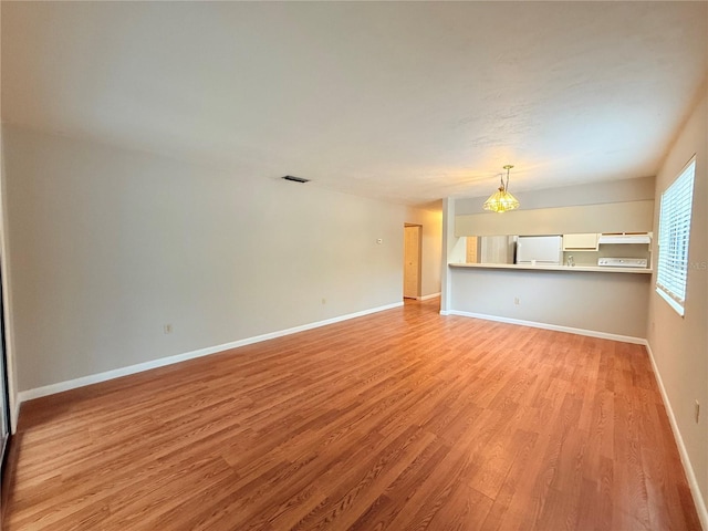 unfurnished living room with light hardwood / wood-style floors