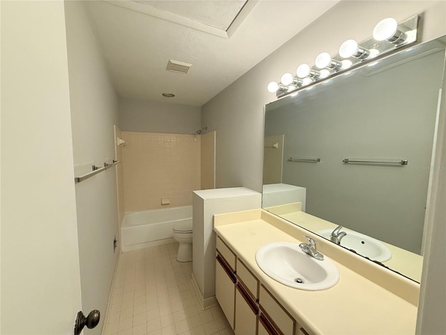 full bathroom with bathtub / shower combination, vanity, and toilet