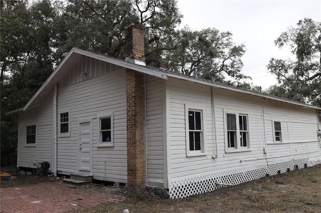 view of side of home with a patio