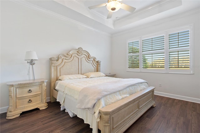 bedroom featuring a tray ceiling, ceiling fan, crown molding, and dark hardwood / wood-style floors