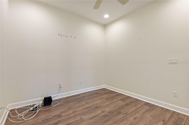 unfurnished room with dark hardwood / wood-style floors and ceiling fan