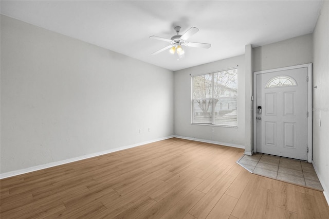 foyer featuring ceiling fan and light hardwood / wood-style floors