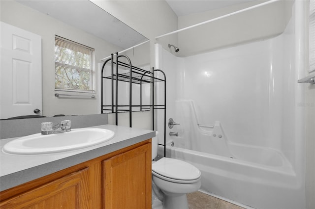 full bathroom with tile patterned flooring, vanity, shower / bathtub combination, and toilet