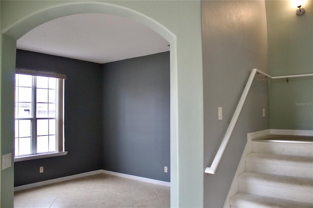 stairs with tile patterned floors