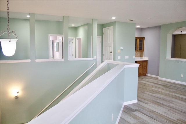 hallway with light wood-type flooring