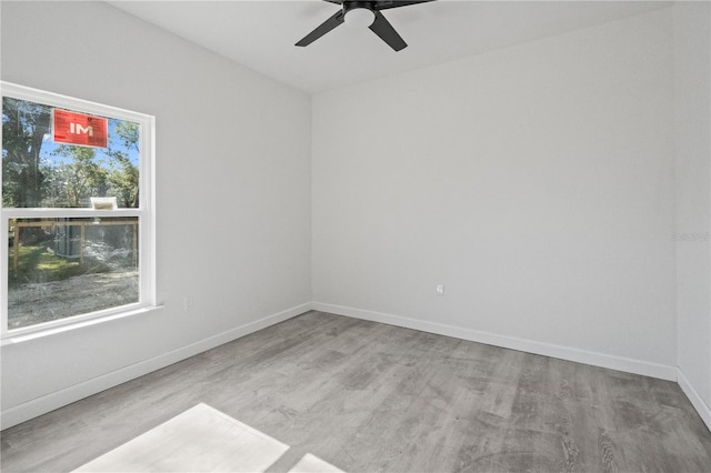 unfurnished room featuring ceiling fan and light hardwood / wood-style floors