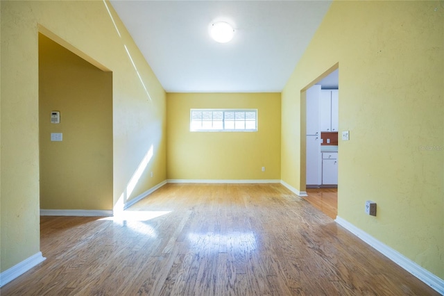 unfurnished room featuring light wood-type flooring