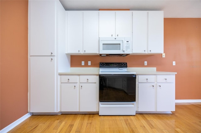 kitchen with white cabinets, white appliances, and light wood-type flooring