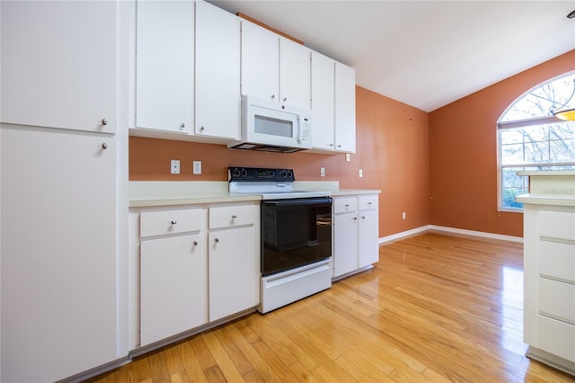 kitchen featuring white appliances, light hardwood / wood-style flooring, and white cabinetry