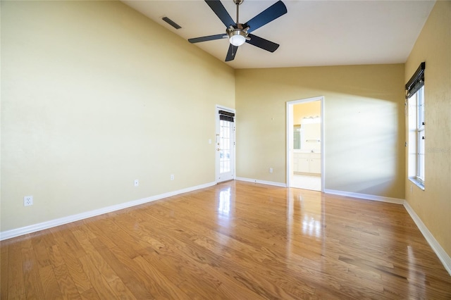 unfurnished room featuring ceiling fan, light wood-type flooring, and vaulted ceiling