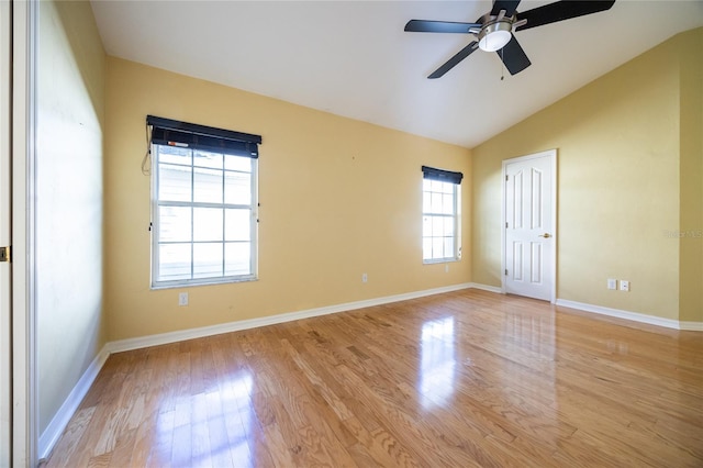 unfurnished room featuring a healthy amount of sunlight, ceiling fan, light hardwood / wood-style floors, and lofted ceiling