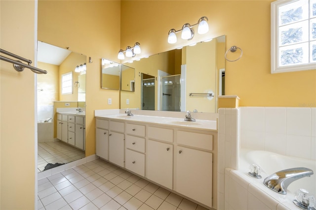 bathroom featuring tile patterned flooring, vanity, plus walk in shower, and vaulted ceiling