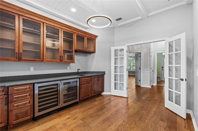 bar featuring indoor wet bar, visible vents, french doors, and wine cooler