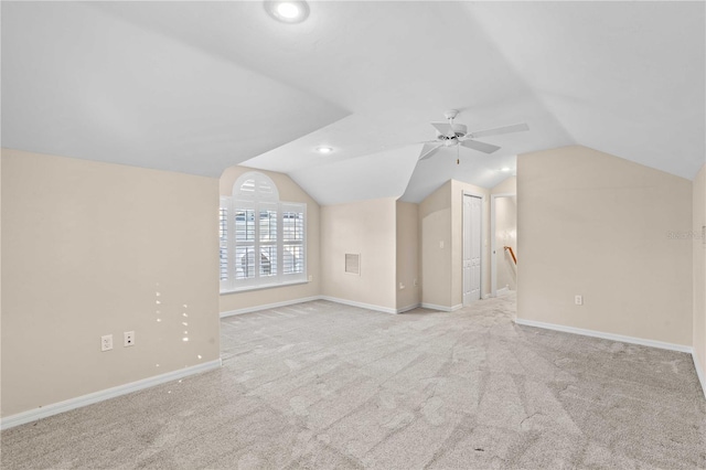 additional living space featuring ceiling fan, lofted ceiling, baseboards, and carpet
