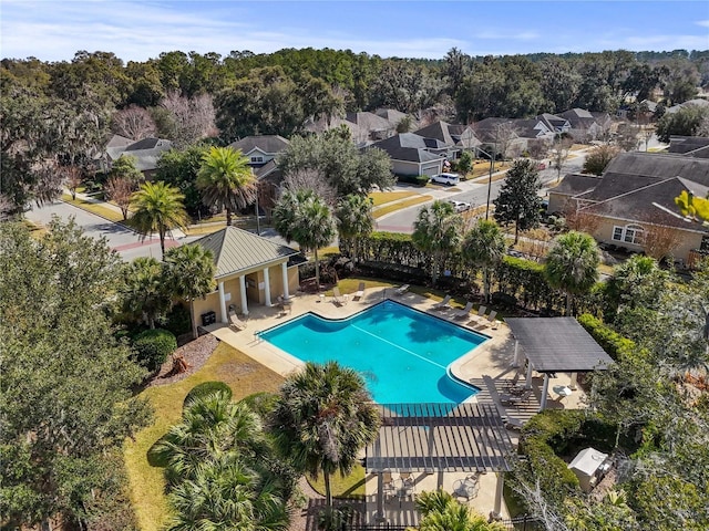 pool featuring a residential view and a patio