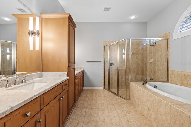 full bathroom with a bath, vanity, visible vents, and a stall shower