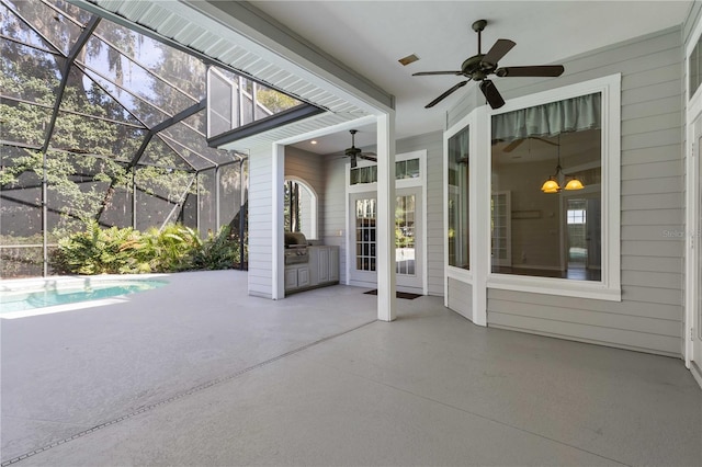 view of patio with ceiling fan, a lanai, and an outdoor pool