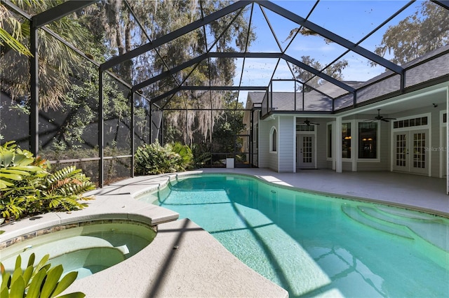 pool with a ceiling fan, french doors, a patio, an in ground hot tub, and a lanai