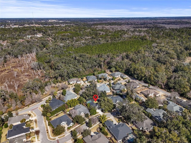 aerial view featuring a residential view and a view of trees