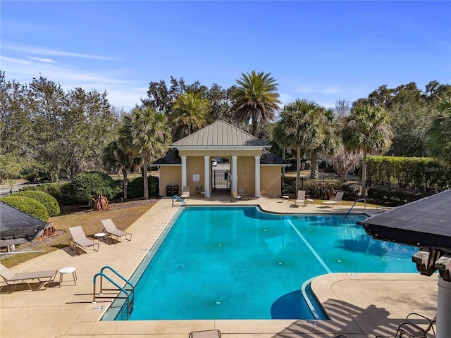 pool featuring central AC unit, a patio, and fence