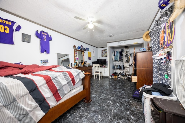 bedroom featuring a textured ceiling, a closet, ceiling fan, and crown molding