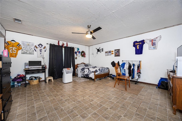 bedroom featuring a textured ceiling and ceiling fan