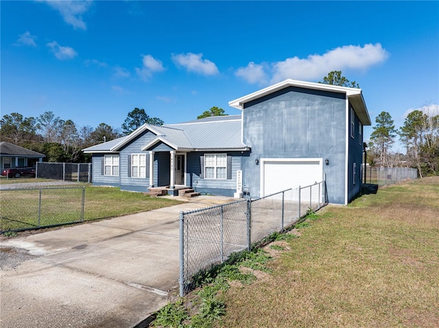 view of front facade with a front yard and a garage