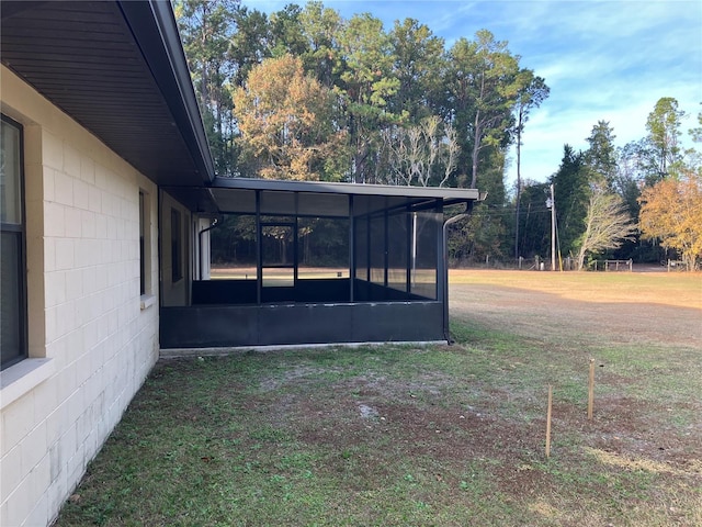 view of yard featuring a sunroom