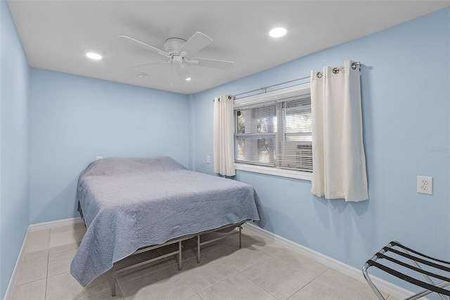 tiled bedroom featuring ceiling fan