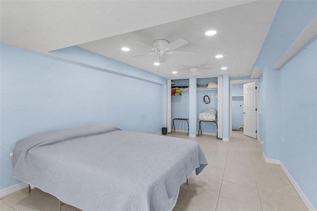 tiled bedroom featuring ceiling fan