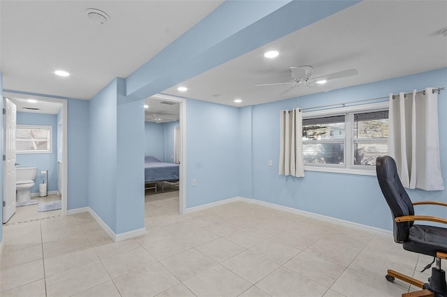 tiled office featuring ceiling fan