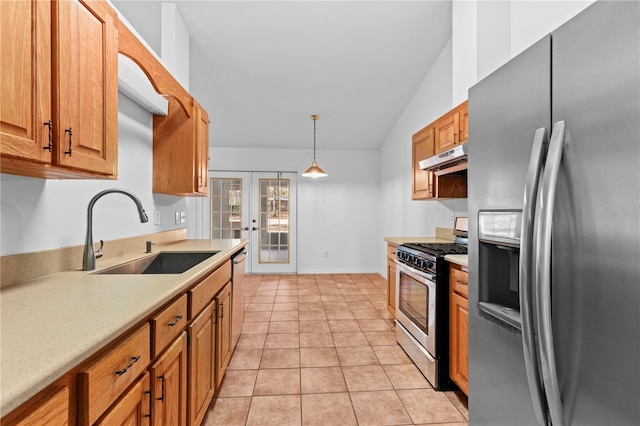 kitchen with appliances with stainless steel finishes, light tile patterned flooring, french doors, pendant lighting, and sink