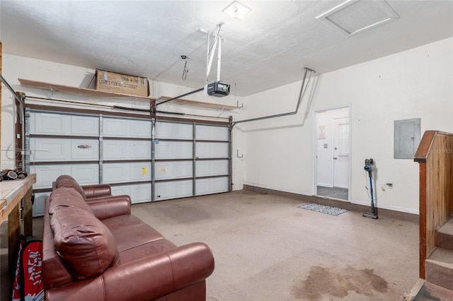 garage with a garage door opener and electric panel