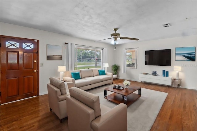 living room featuring ceiling fan and wood-type flooring